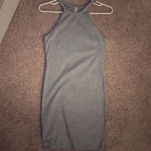 Grey body-con high neck dress.